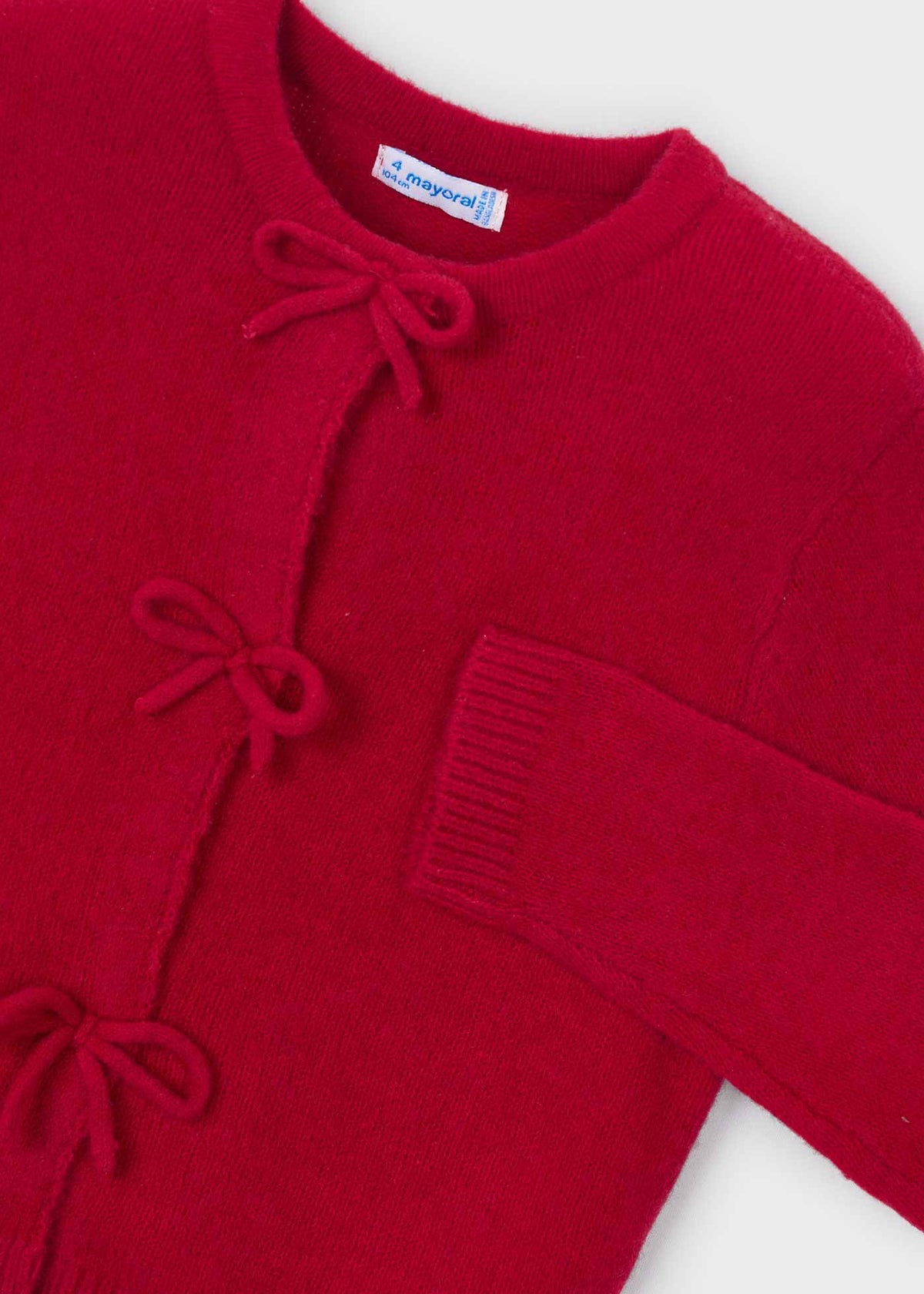 Rebeca tricot lazos niña