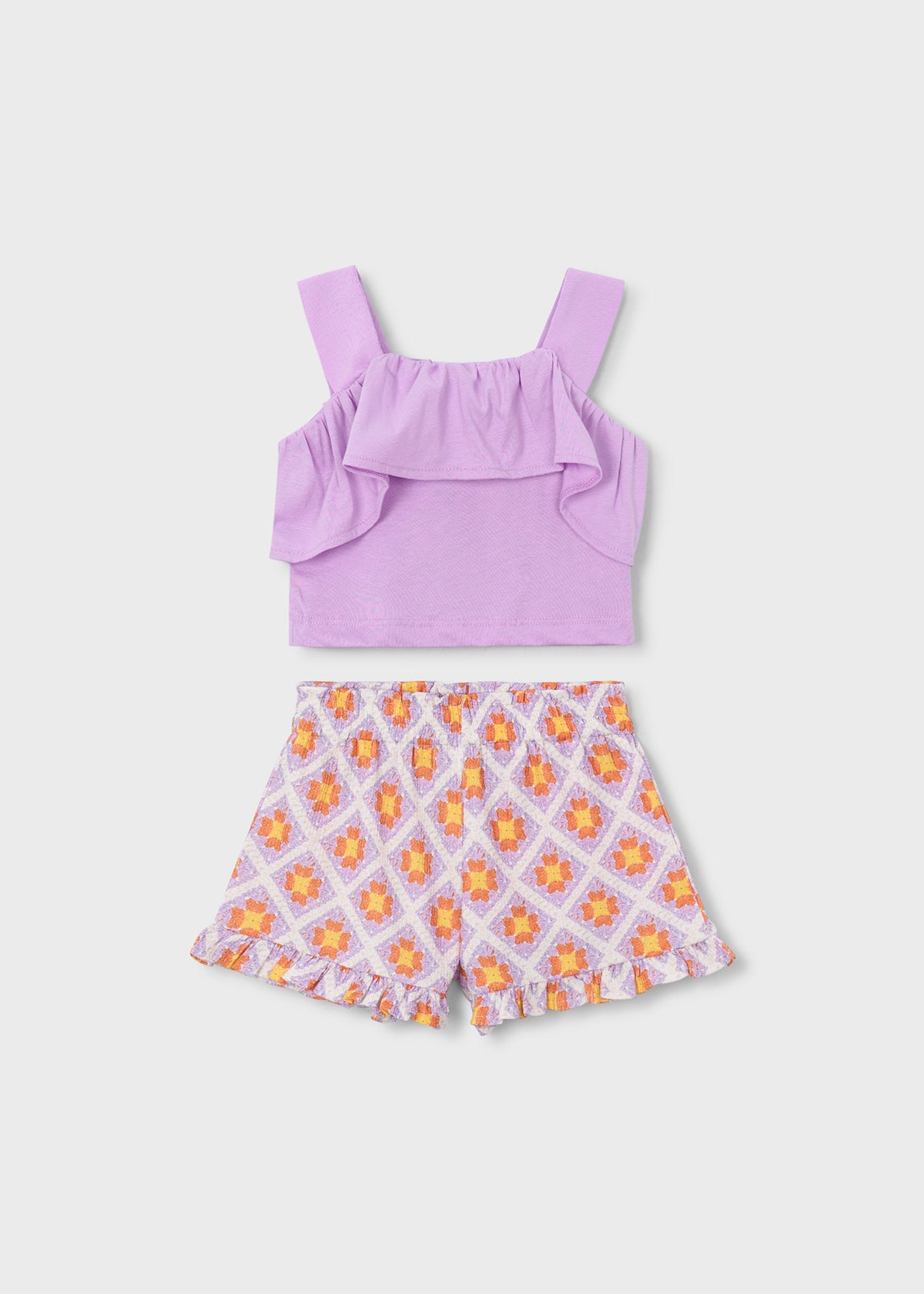 Conjunto pantalón corto estampado y top volantes niña